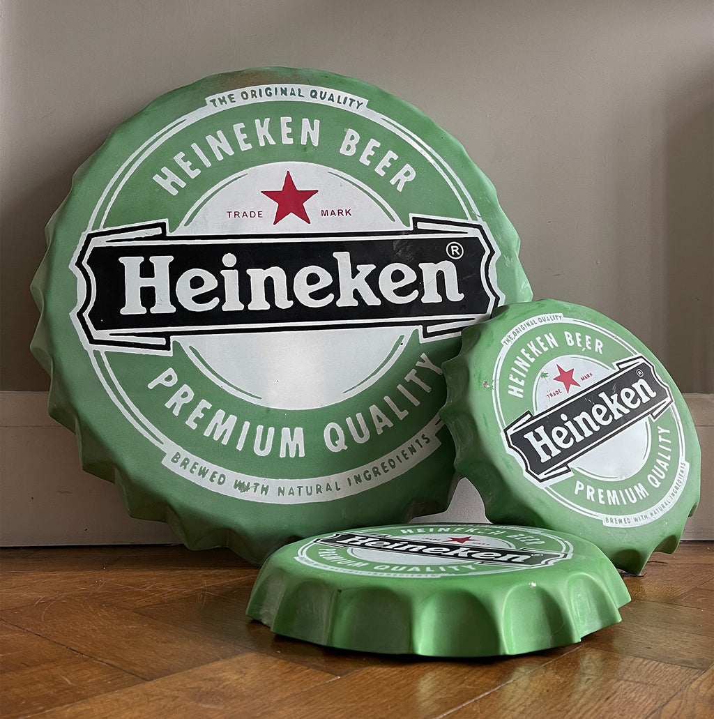 A whopping great big metal Heineken Bottle Cap ready to hang on your wall. Constructed from pressed steel with screen printed graphics to the surface - SHOP NOW - www.intovintage.co.uk