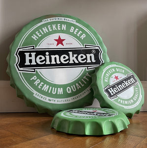 A whopping great big metal Heineken Bottle Cap ready to hang on your wall. Constructed from pressed steel with screen printed graphics to the surface - SHOP NOW - www.intovintage.co.uk