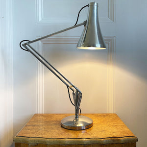 A 1960s Herbert Terry Apex 75 Adjustable Desk Lamp in bare metal. Three capped silver springs and side arms constructed from aluminium with nylon linkages. The fluted shade has a rocker switch to the top - SHOP NOW - www.intovintage.co.uk