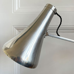 A 1960s Herbert Terry Apex 75 Adjustable Desk Lamp in bare metal. Three capped silver springs and side arms constructed from aluminium with nylon linkages. The fluted shade has a rocker switch to the top - SHOP NOW - www.intovintage.co.uk