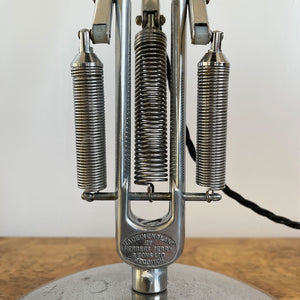 A 1960s Herbert Terry Apex 75 Adjustable Desk Lamp in bare metal. Three capped silver springs and side arms constructed from aluminium with nylon linkages. The fluted shade has a rocker switch to the top - SHOP NOW - www.intovintage.co.uk