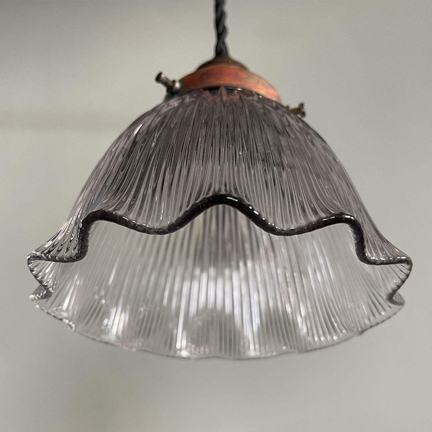 A nicely shaped Holophane Prismatic Glass flared Pendent. It has new braided black flex and new brass bayonet fitting inside. The gallery is in brass and has a fantastic patina to its surface - SHOP NOW - www.intovintage.co.uk