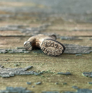 An Advertising Shoe Charm for The Hood Rubber Company. This delightful little shoe has the words 'Hoods Rubbers' on its' sole - SHOP NOW - www.intovintage.co.uk