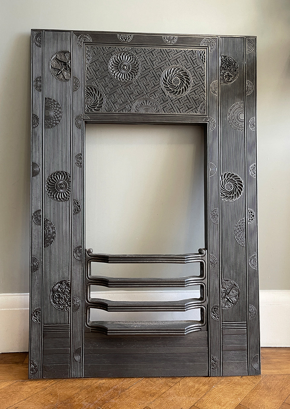 A beautiful Arts & Crafts Cast Iron Fireplace Insert, circa 1873, by the renowned Aesthetic Architect Thomas Jeckyll. The design sees finely cast rosettes of butterflies, bees and stylised floral designs on top of a reeded background. Designed for Barnard, Bishop & Barnards foundry of Norwich - SHOP NOW - www.intovintage.co.uk