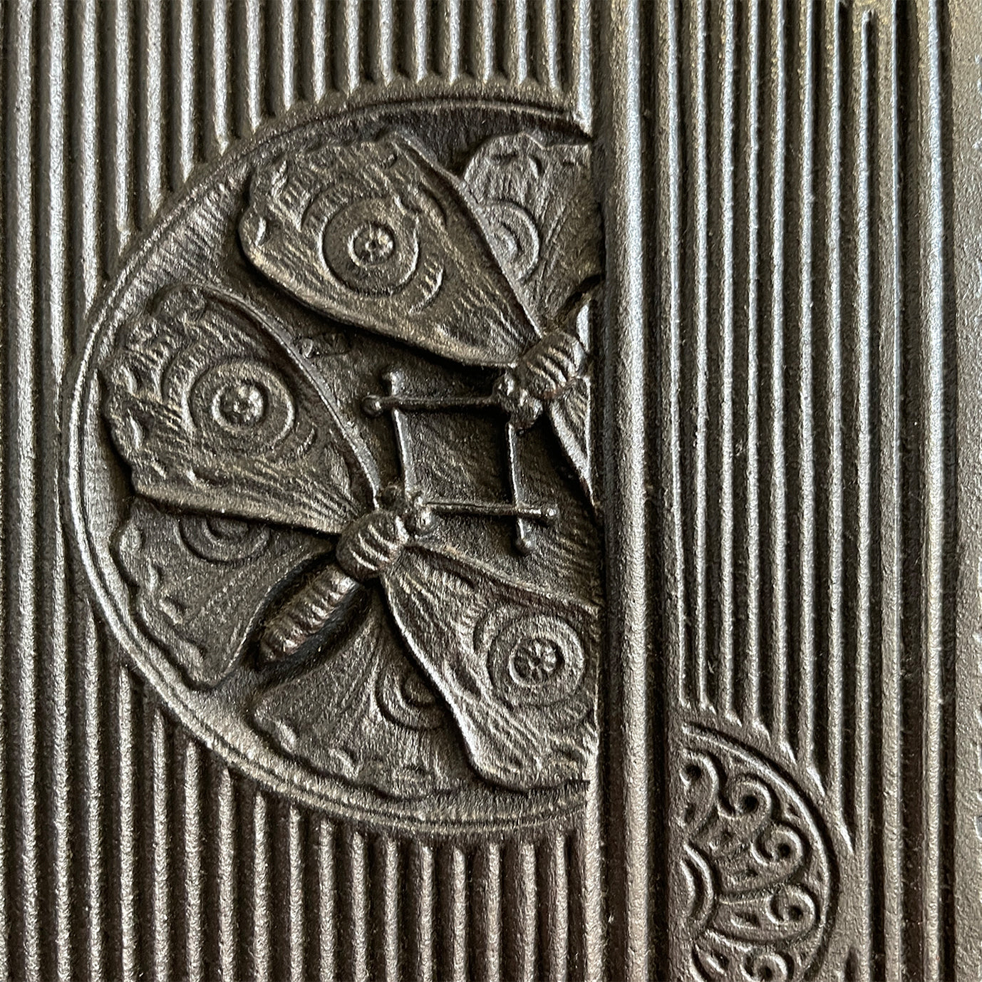 An Arts & Crafts Cast Iron Fireplace Insert, circa 1873, by the renowned Aesthetic Architect Thomas Jeckyll. The design sees finely cast rosettes of butterflies, bees and stylised floral designs on top of a reeded background. Designed for Barnard, Bishop & Barnards foundry of Norwich - SHOP NOW - www.intovintage.co.uk