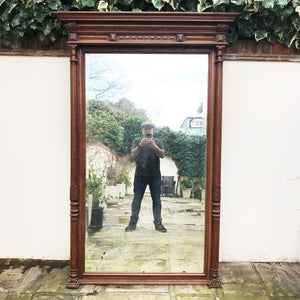 A tall imposing French oak mirror&nbsp;with a lovely warm colour and good amount of foxing to the original mirror plate. Would make a stunning statement on any wall or propped up against a wall - SHOP NOW - www.intovintage.co.uk