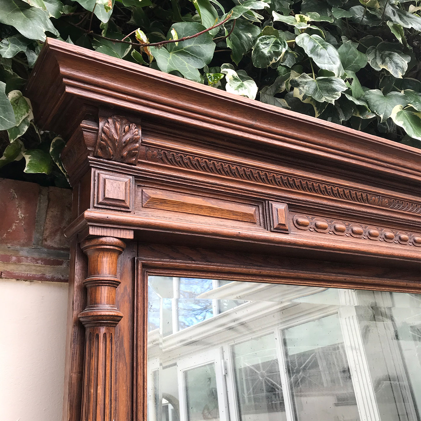A tall imposing French oak mirror&nbsp;with a lovely warm colour and good amount of foxing to the original mirror plate. Would make a stunning statement on any wall or propped up against a wall - SHOP NOW - www.intovintage.co.uk