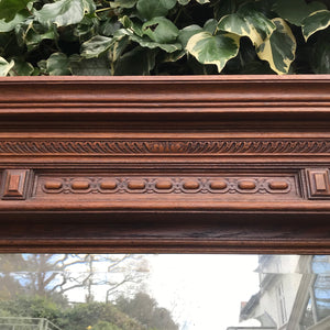A tall imposing French oak mirror&nbsp;with a lovely warm colour and good amount of foxing to the original mirror plate. Would make a stunning statement on any wall or propped up against a wall - SHOP NOW - www.intovintage.co.uk