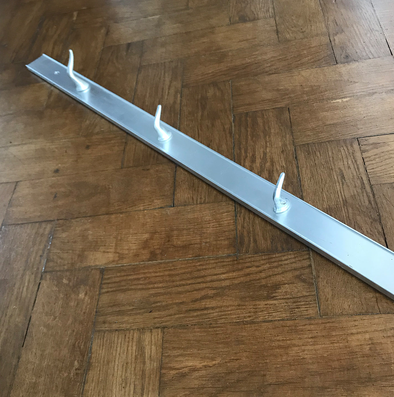 Long Vintage Meat Hook Rack from Belgium. The rack is made of aluminium and has 7 solid aluminium hooks that are bolted from the back -SHOP NOW - www.intovintage.co.uk
