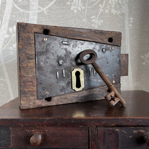 A working Georgian mahogany encased steel door lock with original key. Brass escutcheon to the open face side. The mahogany case has a partly worn makers mark stamped in - SHOP NOW - www.intovintage.co.uk