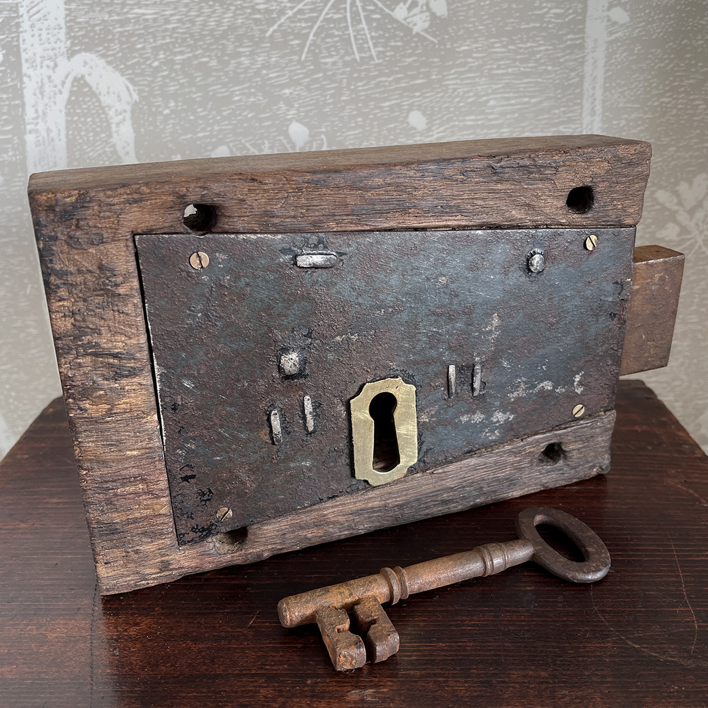 A working Georgian mahogany encased steel door lock with original key. Brass escutcheon to the open face side. The mahogany case has a partly worn makers mark stamped in - SHOP NOW - www.intovintage.co.uk
