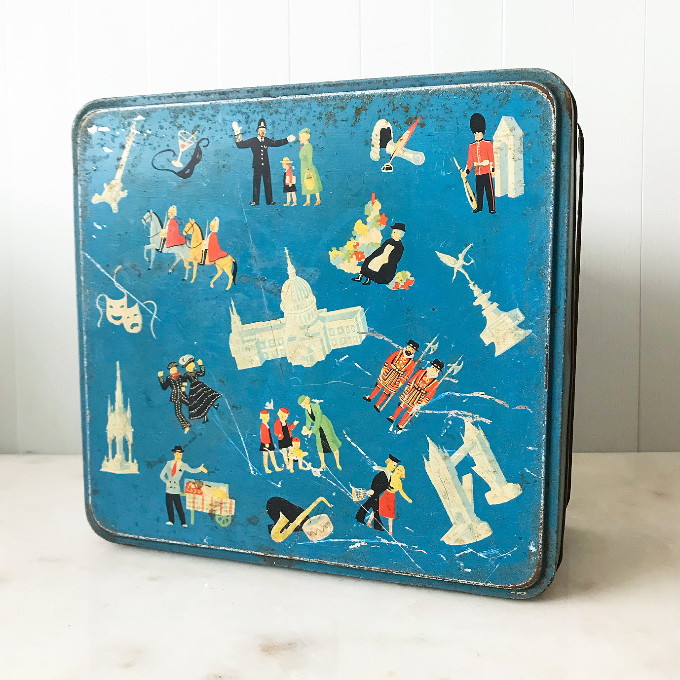 Vintage Frears London Town Biscuit Tin with delightful vignette illustrations of London life from the 50's. There's a Pearly King & Queen having a jig, an Elephant taking some children for a ride, people taking the tube and a whole lot more! SHOP NOW - www.intovintage.co.uk