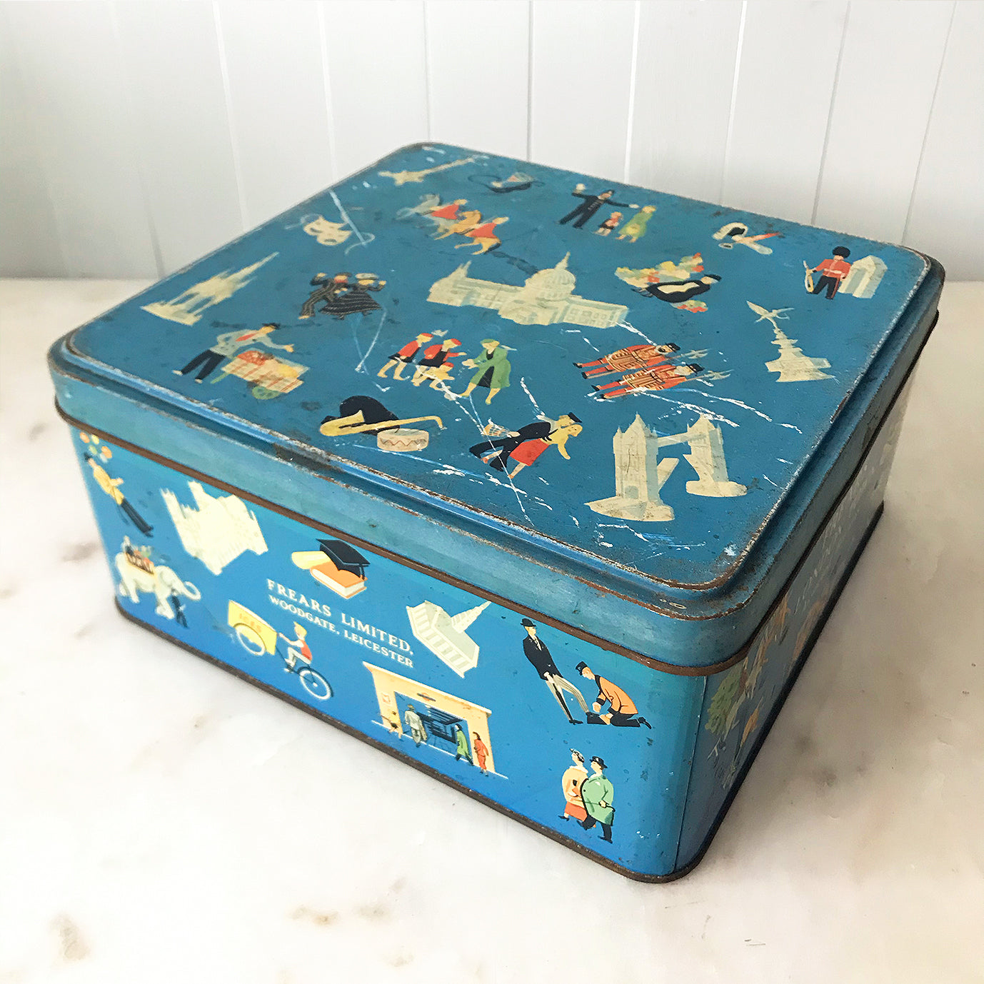 Vintage Frears London Town Biscuit Tin with delightful vignette illustrations of London life from the 50's. There's a Pearly King & Queen having a jig, an Elephant taking some children for a ride, people taking the tube and a whole lot more! SHOP NOW - www.intovintage.co.uk