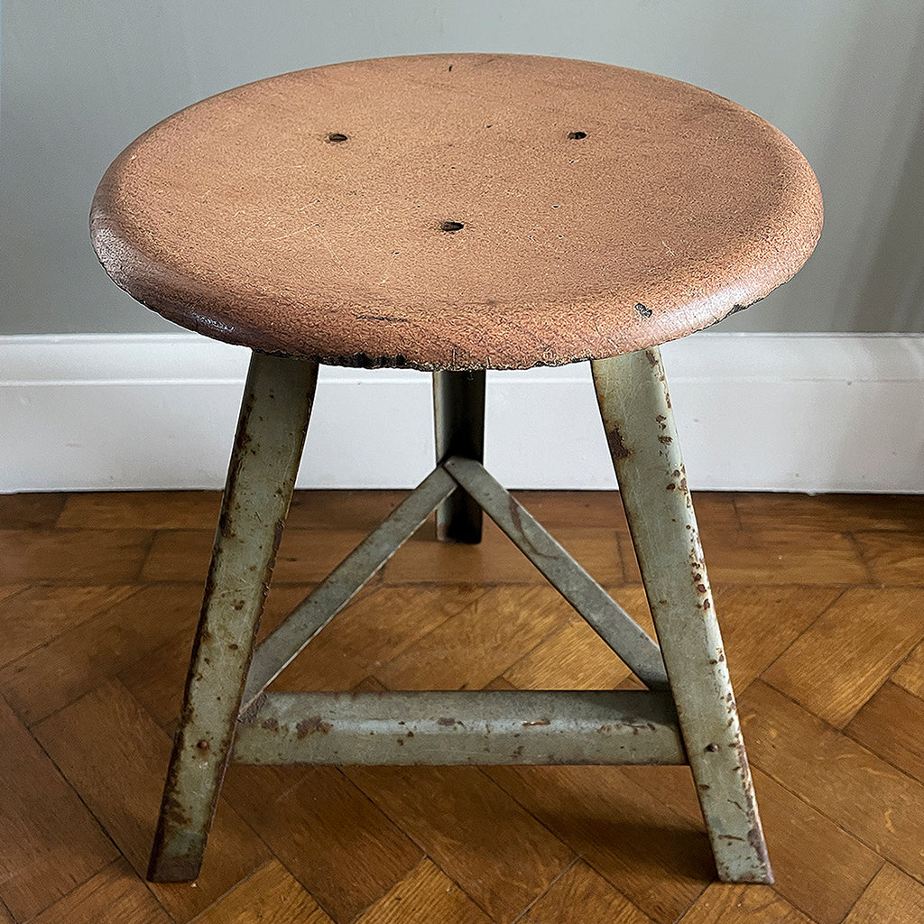 Good looking Vintage Metal and Wood Painted Stool. Great age related wear, patina and totally solid. The light green paint has worn and chipped away giving the stool that bang on look. The wooded seat section has its original painted wood graining paint and shows signs of years of workshop use and ware. A great looking stool that would compliment any setting. 