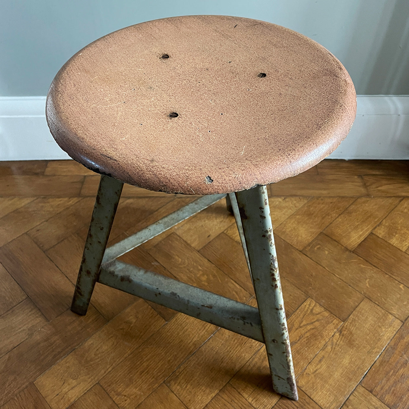 Good looking Vintage Metal and Wood Painted Stool. Great age related wear, patina and totally solid. The light green paint has worn and chipped away giving the stool that bang on look. The wooded seat section has its original painted wood graining paint and shows signs of years of workshop use and ware. A great looking stool that would compliment any setting. 