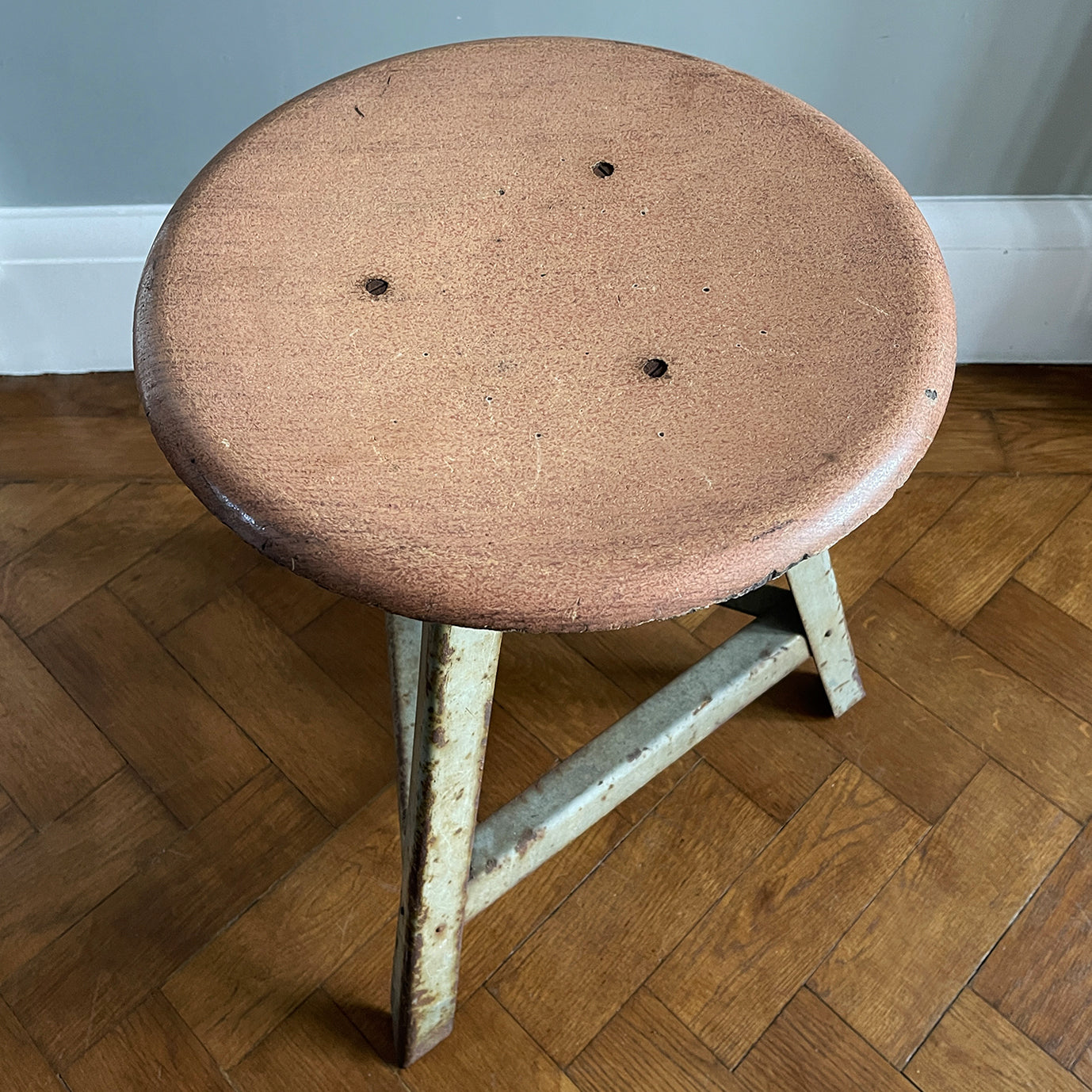 Good looking Vintage Metal and Wood Painted Stool. Great age related wear, patina and totally solid. The light green paint has worn and chipped away giving the stool that bang on look. The wooded seat section has its original painted wood graining paint and shows signs of years of workshop use and ware. A great looking stool that would compliment any setting. 