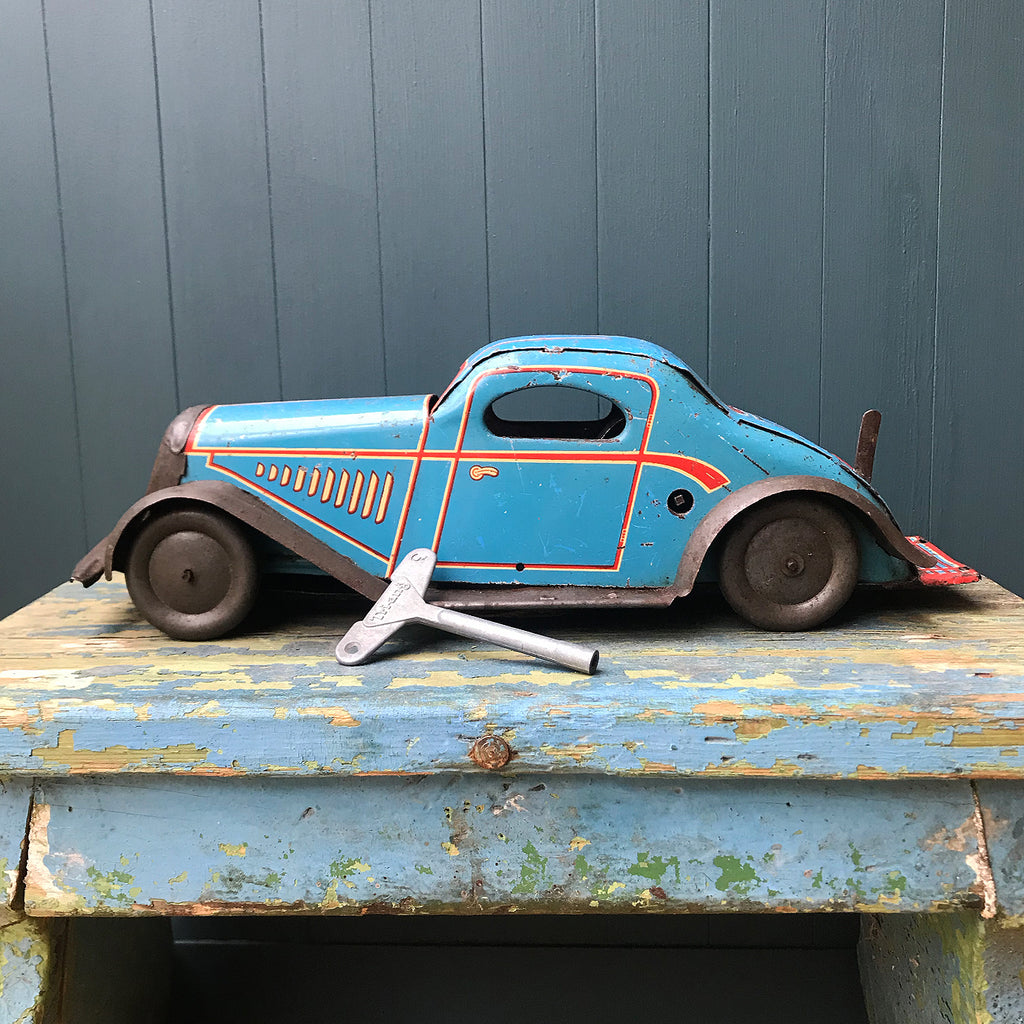 Rare large pre-war 1935 Marx clockwork tinplate LMC 217 Mechanical Coupé in the rare blue pinstripe finish. Marked 'Made in England' on the boot and still having its back running step. This model was made in the Marx Dudley factory - SHOP NOW - www.intovintage.co.uk