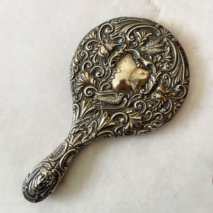 A Highly Decorated Antique Hand Mirror