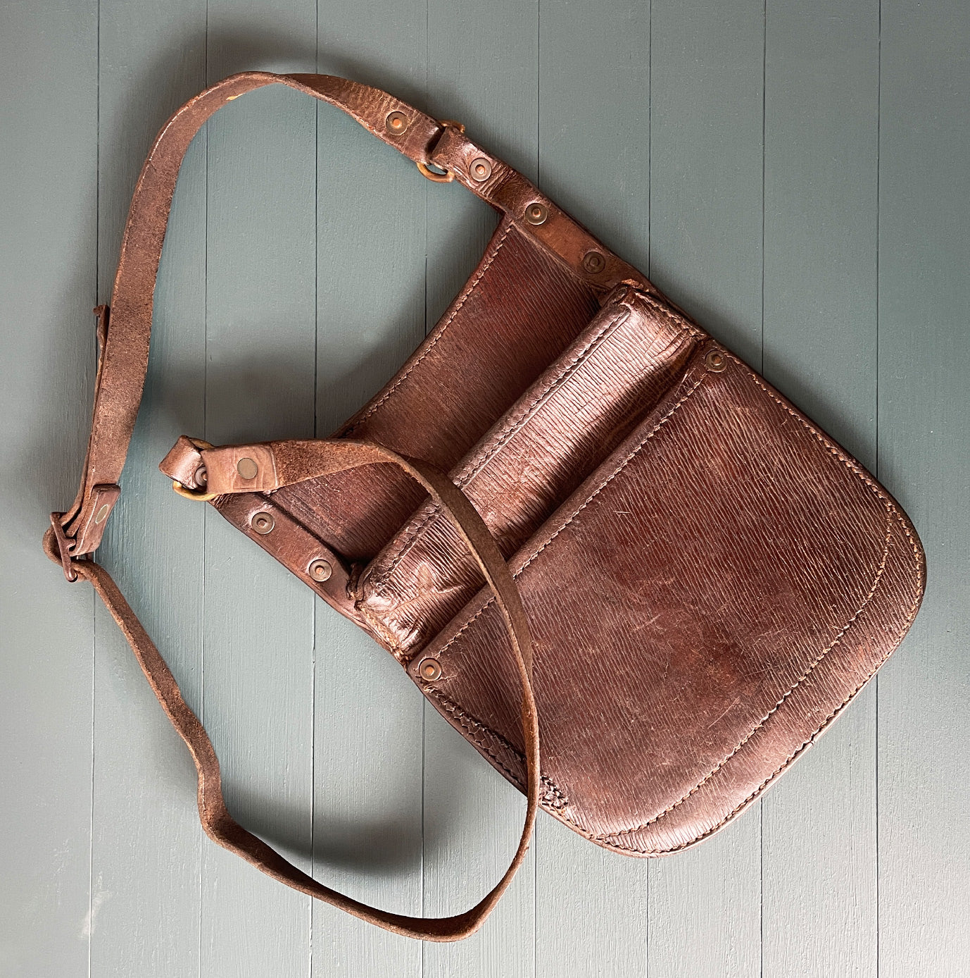 Vintage Bus Conductors Leather Money Bag made from quality thick leather with studded copper rivets and brass buckles. Stamped 'A3969' on the reverse. It has two good sized pockets perfect for your cash and loose change - SHOP NOW - www.intovintage.co.uk