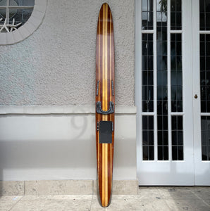 Uber cool vintage wooden mono water ski. It has a wonderful warm tone to the two tone wood. We have removed the old rubber footholds and given it a polish so that it can be seen in its full glory when mounted on the wall - SHOP NOW - www.intovintage.co.uk