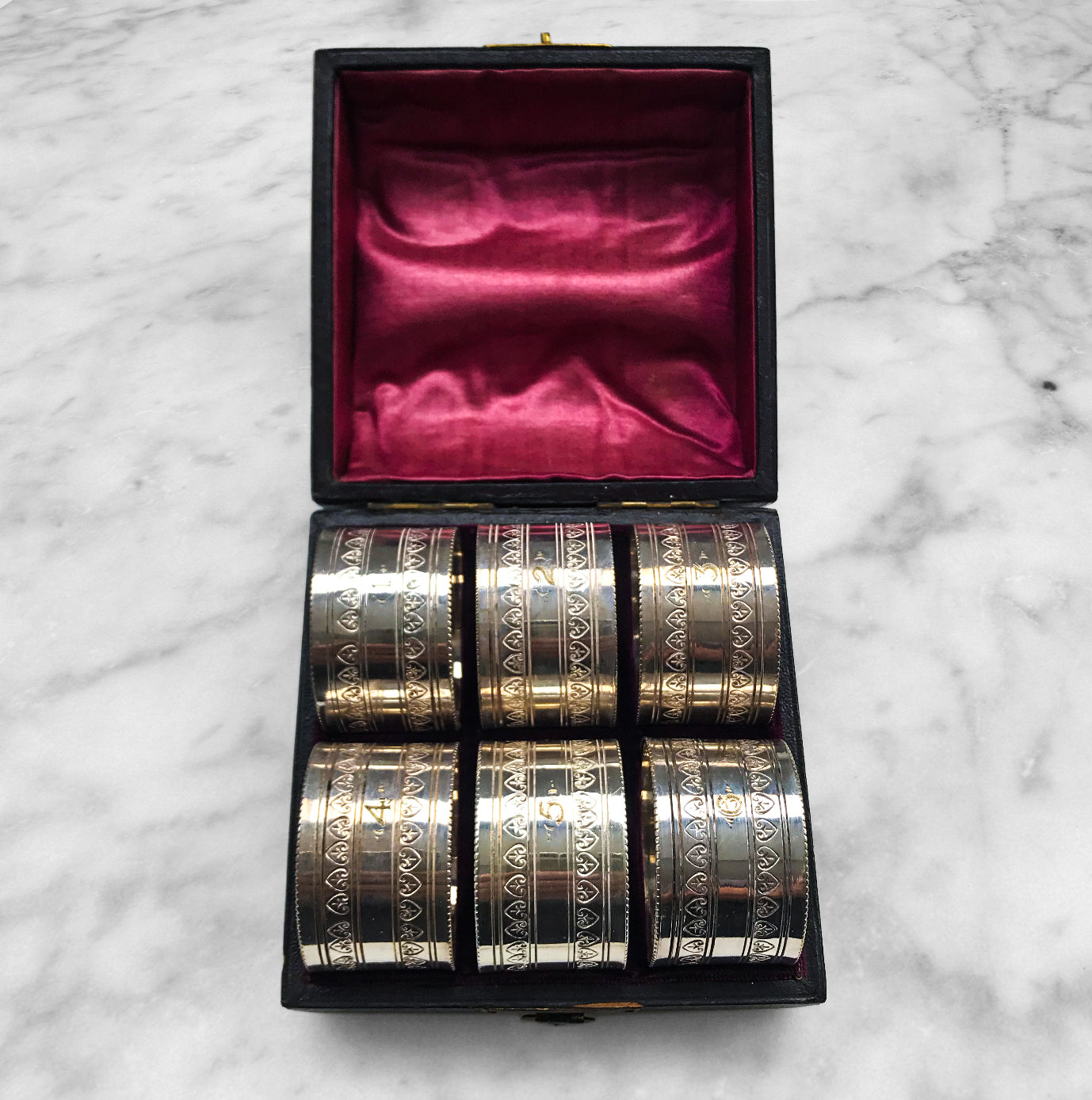 Nice set of 6 Edwardian Napkin Rings in a leather and satin case. Each ring is numbered from 1 to 6. Unmarked but probably silver plated - SHOP NOW - www.intovintage.co.uk