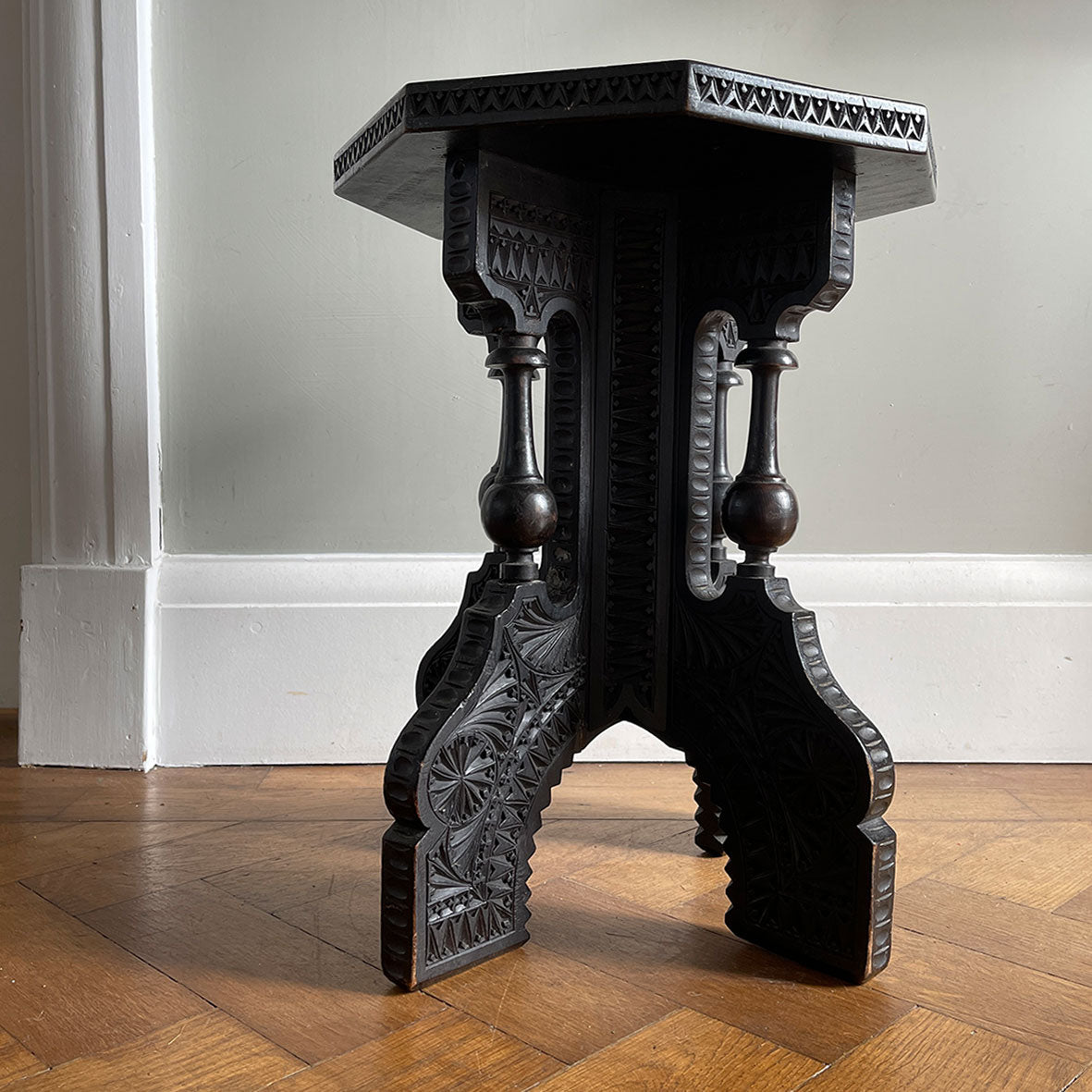 A Carved Ebonised Occasional Table. It has an octagonal top and is covered in beautiful decorative carving - SHOP NOW - www.intovintage.co.uk