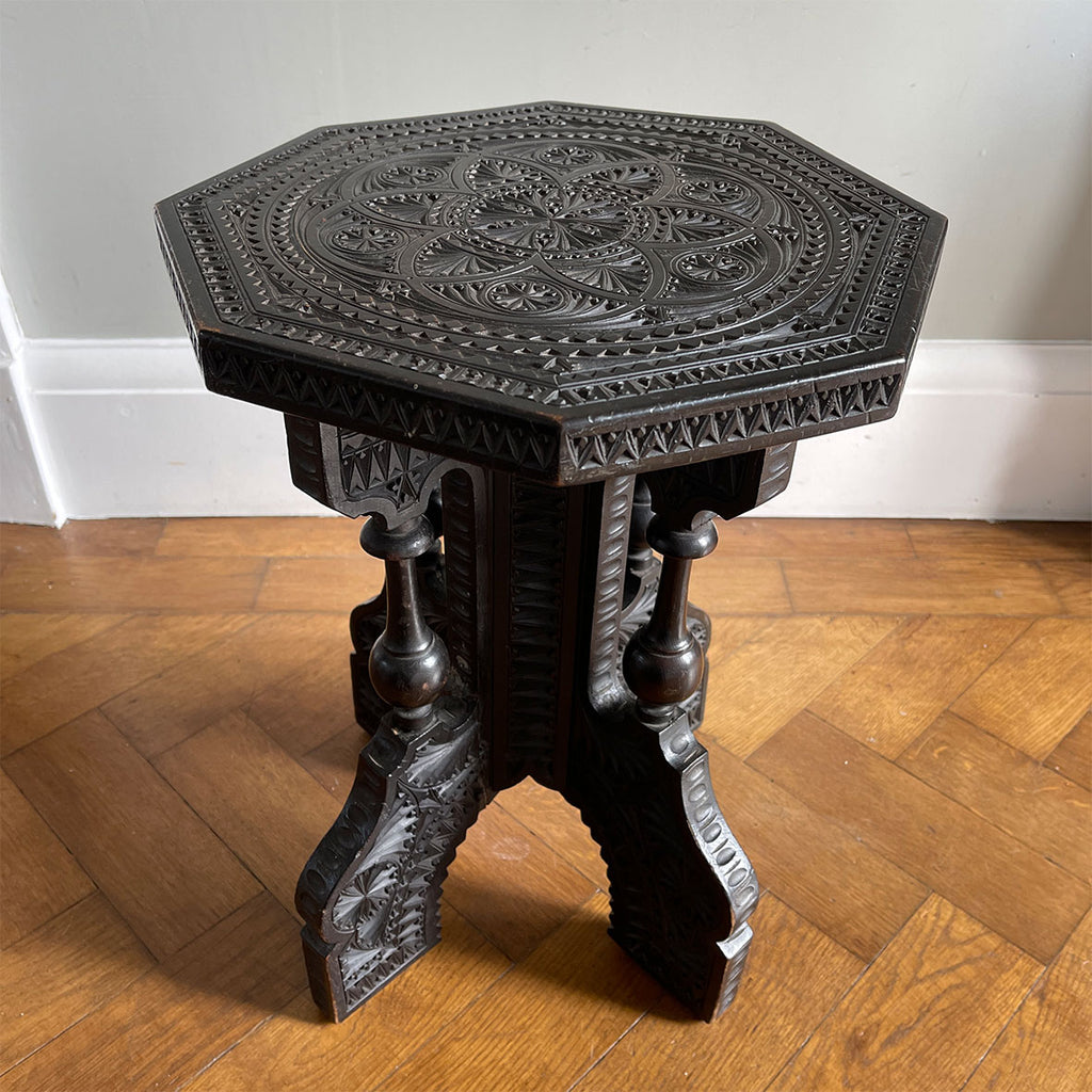 A Carved Ebonised Occasional Table. It has an octagonal top and is covered in beautiful decorative carving - SHOP NOW - www.intovintage.co.uk