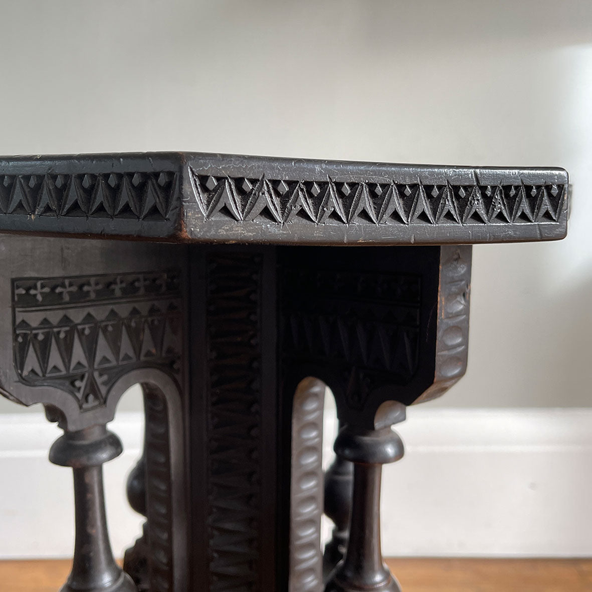 A Carved Ebonised Occasional Table. It has an octagonal top and is covered in beautiful decorative carving - SHOP NOW - www.intovintage.co.uk