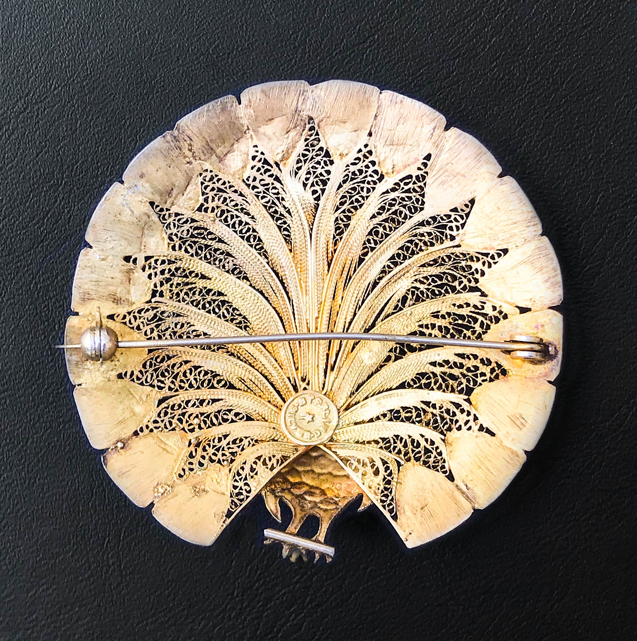 An excellent quality vintage brooch with delicate filigree detail finished in gilded silver with bright enamelled details on the peacock's body and at the end of his plumage - SHOP NOW - www.intovintage.co.uk