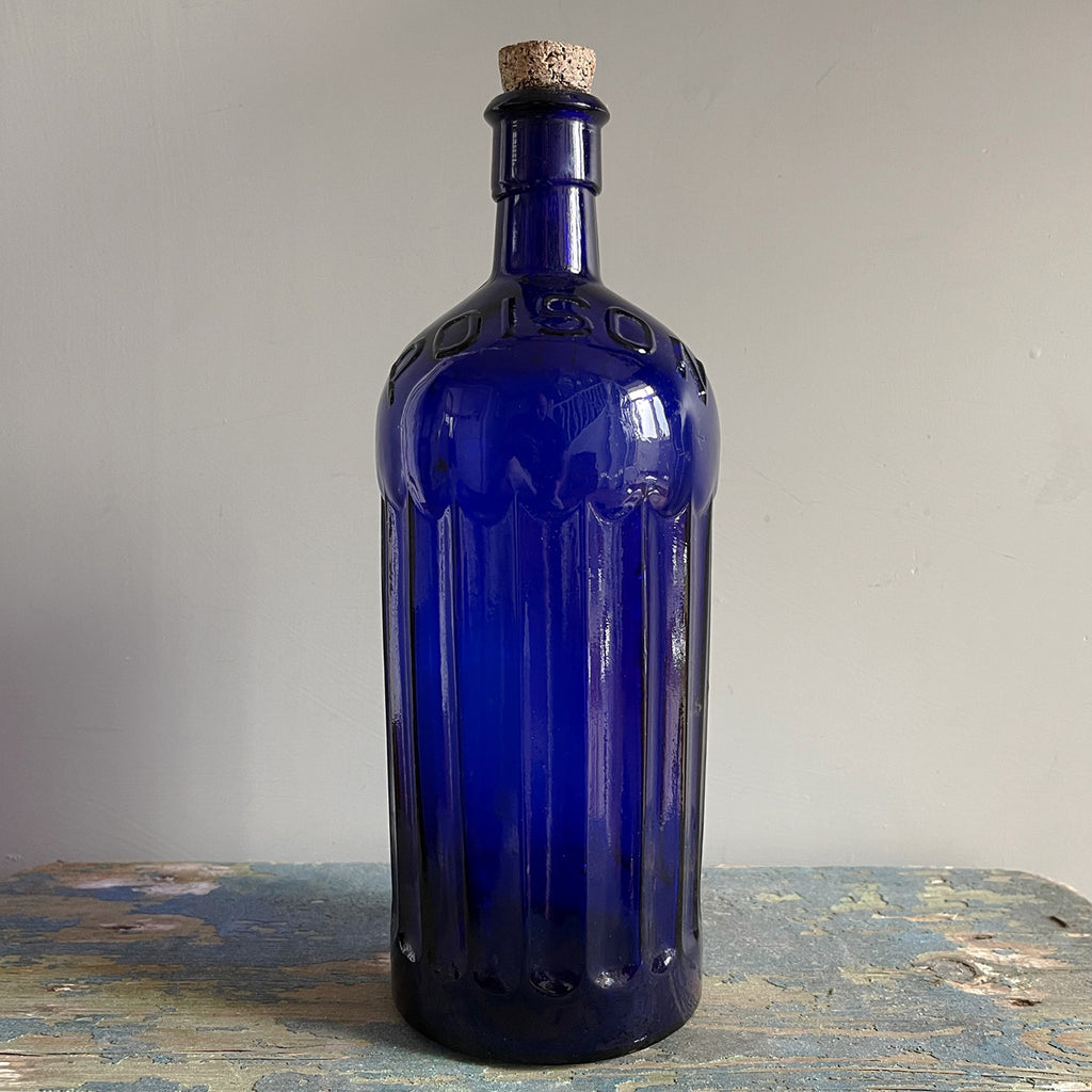 A Large Victorian Poison Bottle with cork stopper. It has fluted sides and two moulded 'POISON' words across the front and back shoulders. These bottles look great displayed in the bathroom or in a curio cabinet - SHOP NOW - www.intovintage.co.uk