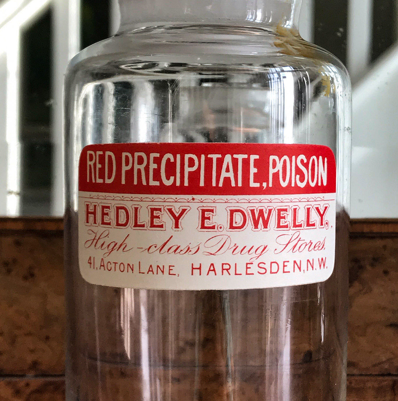 Vintage Clear Apothecary Poison Bottle with an original paper label from Hedley E. Dwelly, High-Class Drug Stores, 41, Acton Lane, Harlesden. N.W. London - SHOP NOW - www.intovintage.co.uk