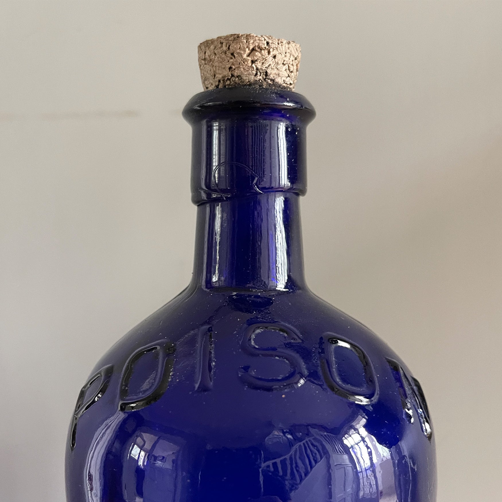 A Large Victorian Poison Bottle with cork stopper. It has fluted sides and two moulded 'POISON' words across the front and back shoulders. These bottles look great displayed in the bathroom or in a curio cabinet - SHOP NOW - www.intovintage.co.uk