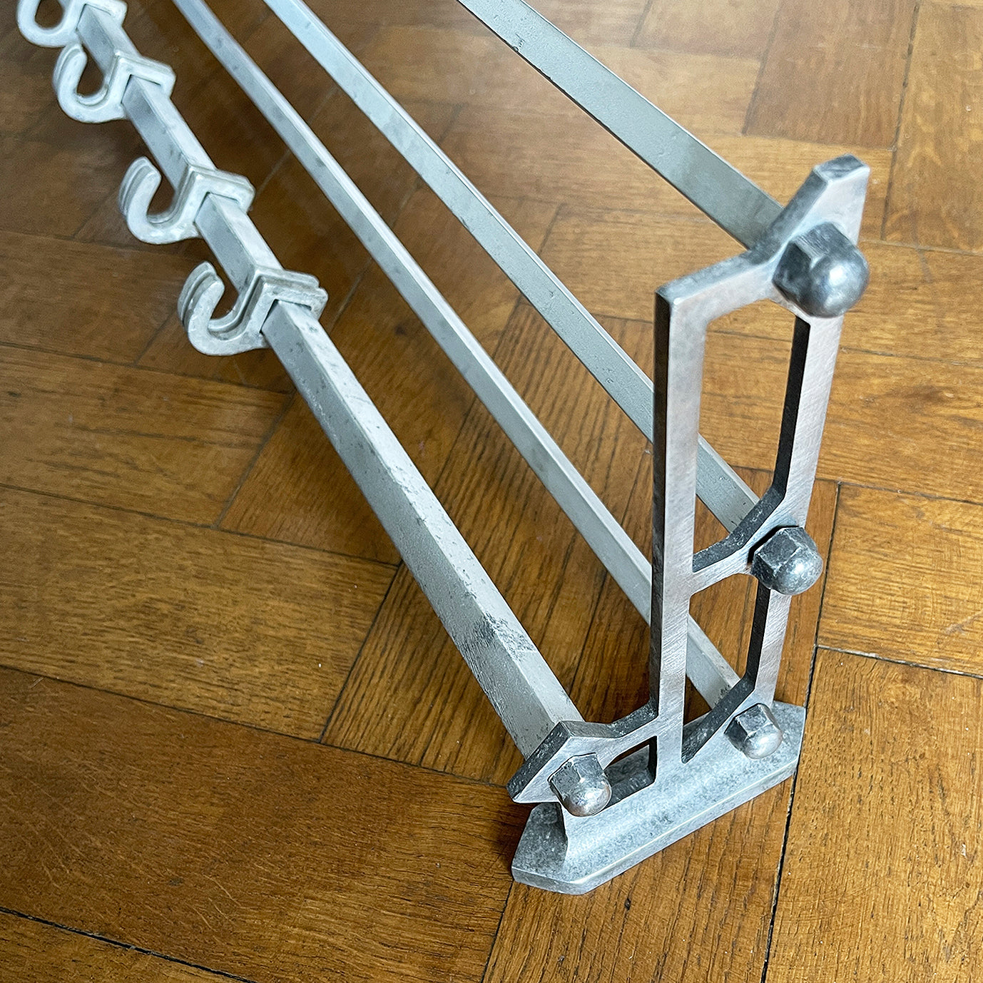 An Aluminium Art Deco Train Coat Rack, having three slats to the top section where you can place your hats and a bottom ball that has eight sliding coat hooks. The ends have a simple Art Deco styling to them - SHOP NOW - www.intovintage.co.uk