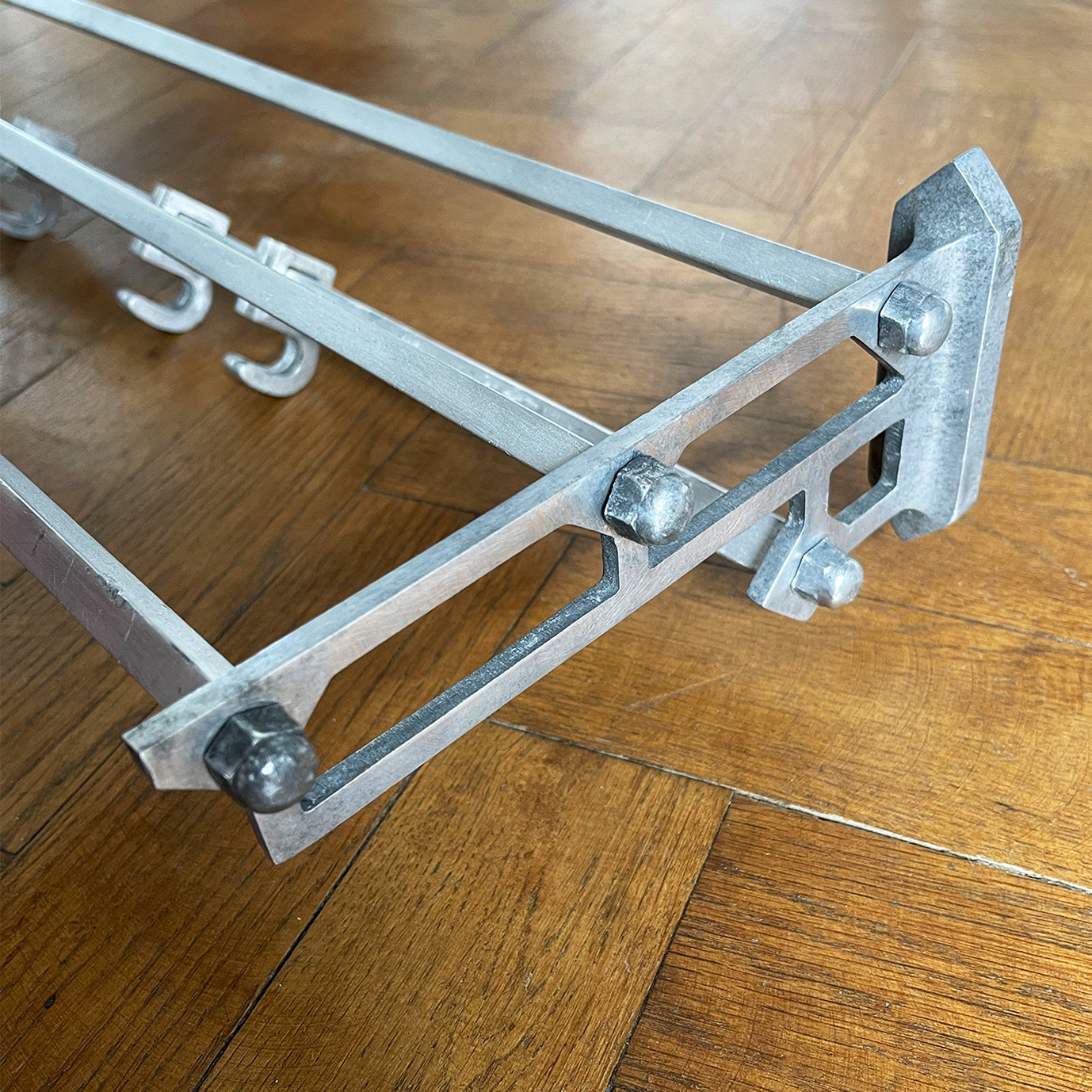 An Aluminium Art Deco Train Coat Rack, having three slats to the top section where you can place your hats and a bottom ball that has eight sliding coat hooks. The ends have a simple Art Deco styling to them - SHOP NOW - www.intovintage.co.uk