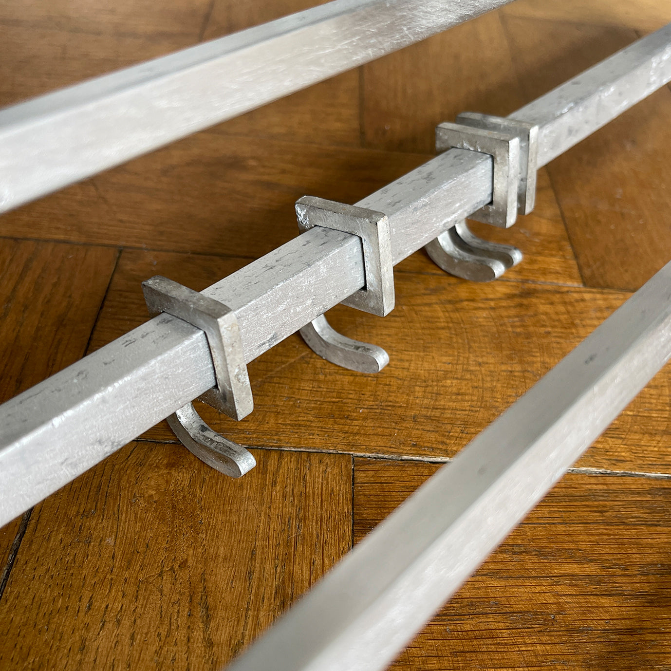 An Aluminium Art Deco Train Coat Rack, having three slats to the top section where you can place your hats and a bottom ball that has eight sliding coat hooks. The ends have a simple Art Deco styling to them - SHOP NOW - www.intovintage.co.uk