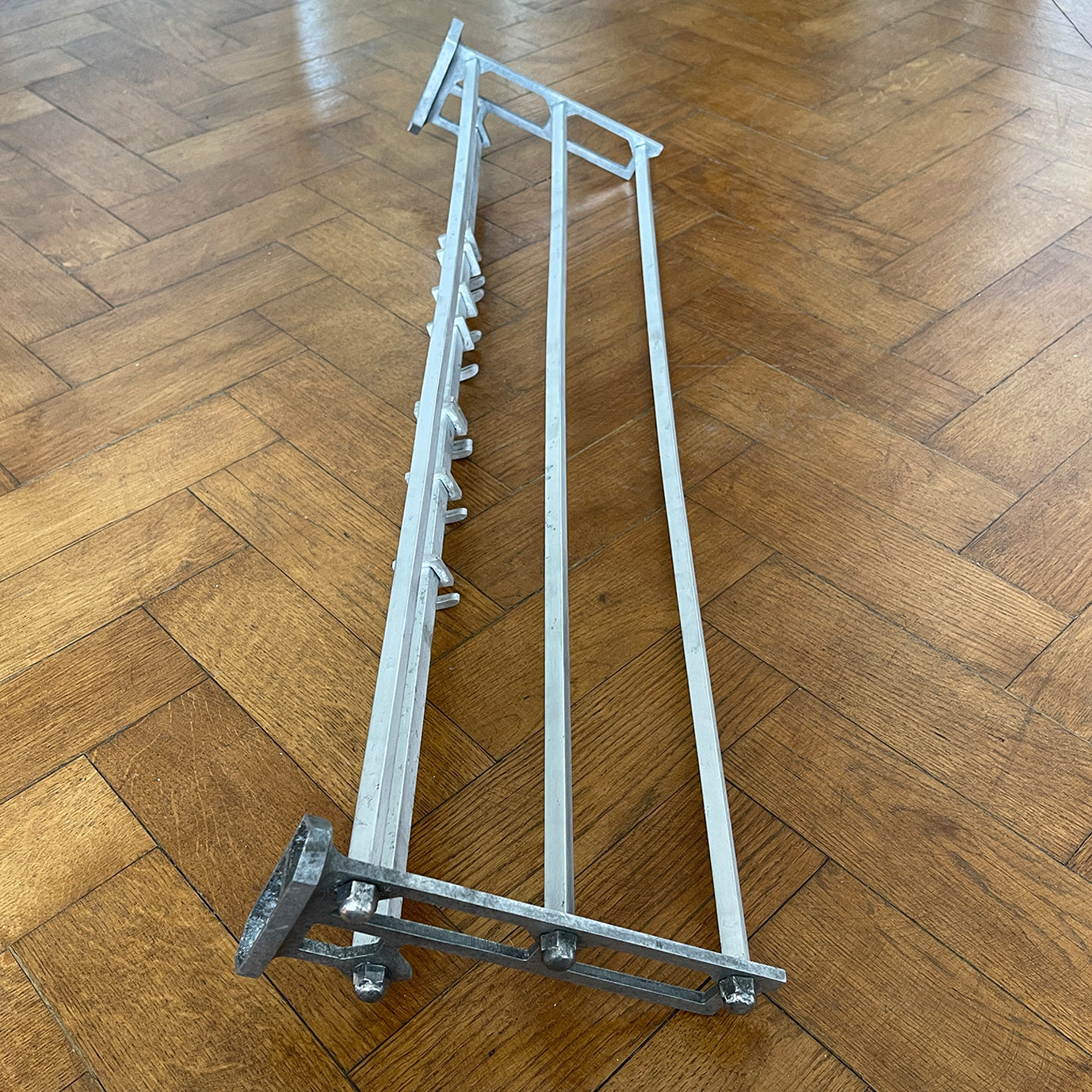 An Aluminium Art Deco Train Coat Rack, having three slats to the top section where you can place your hats and a bottom ball that has eight sliding coat hooks. The ends have a simple Art Deco styling to them - SHOP NOW - www.intovintage.co.uk