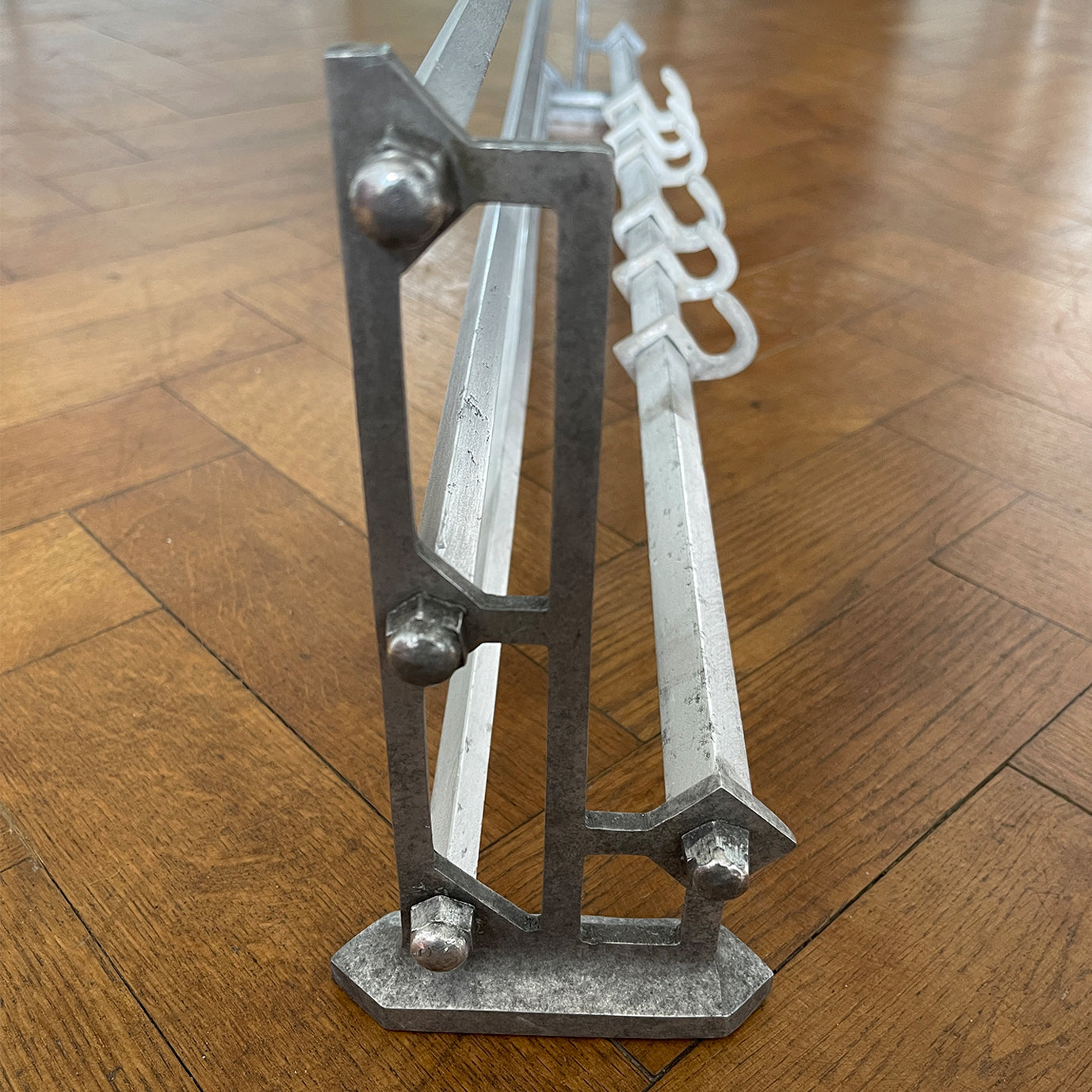 An Aluminium Art Deco Train Coat Rack, having three slats to the top section where you can place your hats and a bottom ball that has eight sliding coat hooks. The ends have a simple Art Deco styling to them - SHOP NOW - www.intovintage.co.uk