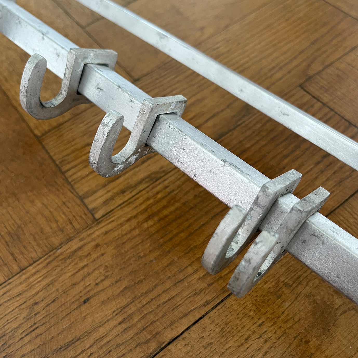 An Aluminium Art Deco Train Coat Rack, having three slats to the top section where you can place your hats and a bottom ball that has eight sliding coat hooks. The ends have a simple Art Deco styling to them - SHOP NOW - www.intovintage.co.uk