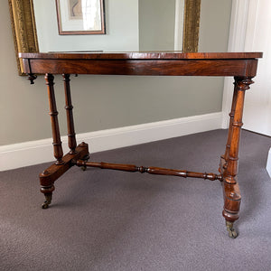 A mid Victorian rosewood stretcher base table with well figured rectangular top that sits upon turned legs and stretcher, raised on original brass castors. English. Superb condition. - SHOP NOW - www.intovintage.co.uk