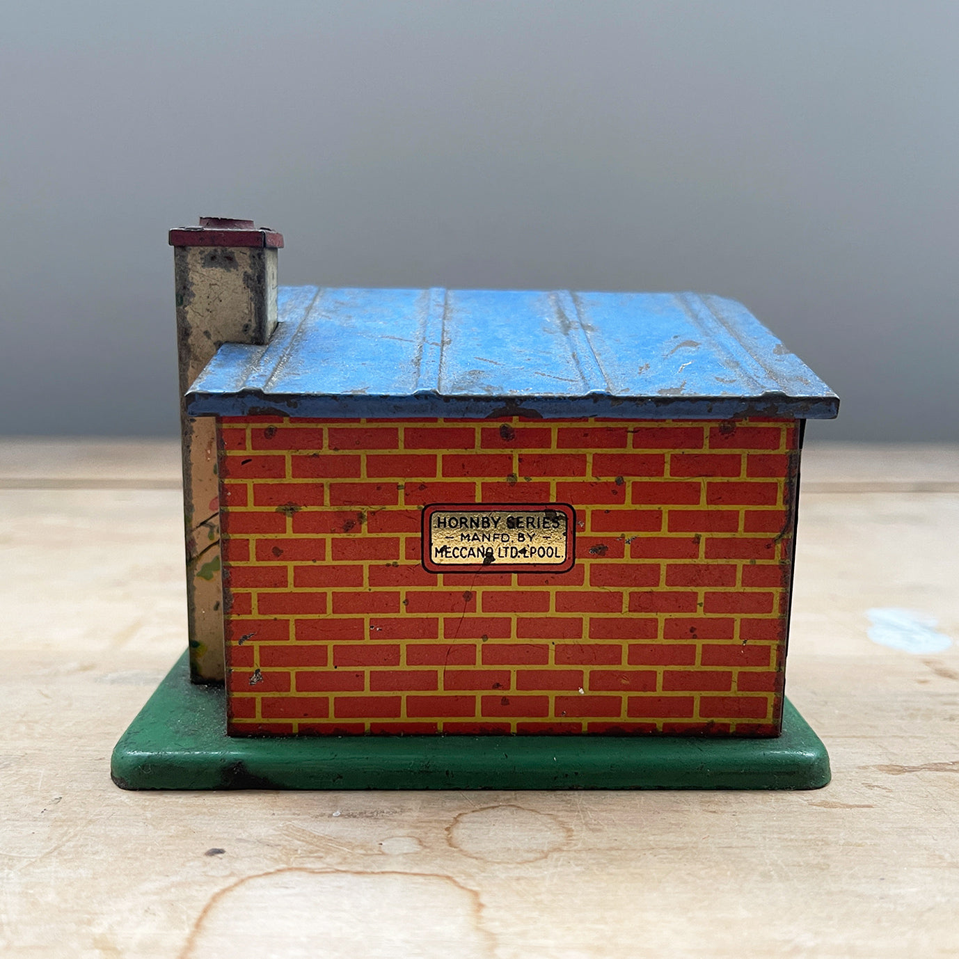 A scarce pre-war Hornby/Meccano O Gauge Tinplate Brink Allotment Shed. Great colours and detail within the print. The Hornby/Meccano mark appears on the reverse - SHOP NOW - www.intovintage.co.uk