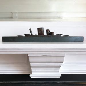 In rust we trust... Stylish old wood and lithographed tin plate battle ship with a great patina. Four gun turrets, three funnels and bridge with tiny sailors at the helm - SHOP NOW - www.intovintage.co.uk