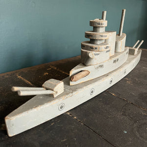 A stylish old wooden Exploding Battle Ship. Two gun turrets, two funnels, bridge and firing torpedo tube. The hull has a pressure button on the side that when struck activates an internal mechanism that explodes the top sections of the ship - SHOP NOW - www.intovintage.co.uk