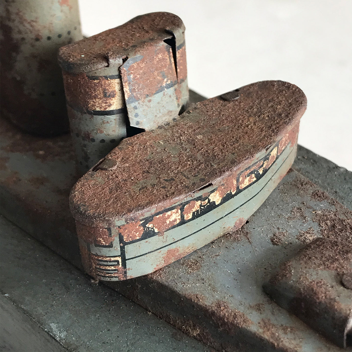 In rust we trust... Stylish old wood and lithographed tin plate battle ship with a great patina. Four gun turrets, three funnels and bridge with tiny sailors at the helm - SHOP NOW - www.intovintage.co.uk