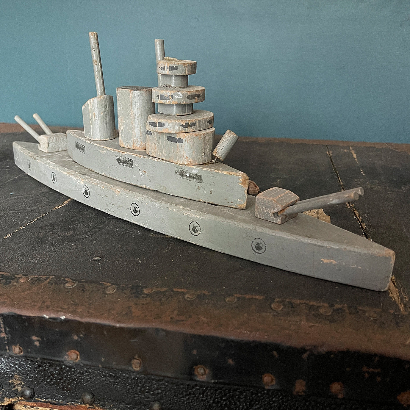 A stylish old wooden Exploding Battle Ship. Two gun turrets, two funnels, bridge and firing torpedo tube. The hull has a pressure button on the side that when struck activates an internal mechanism that explodes the top sections of the ship - SHOP NOW - www.intovintage.co.uk