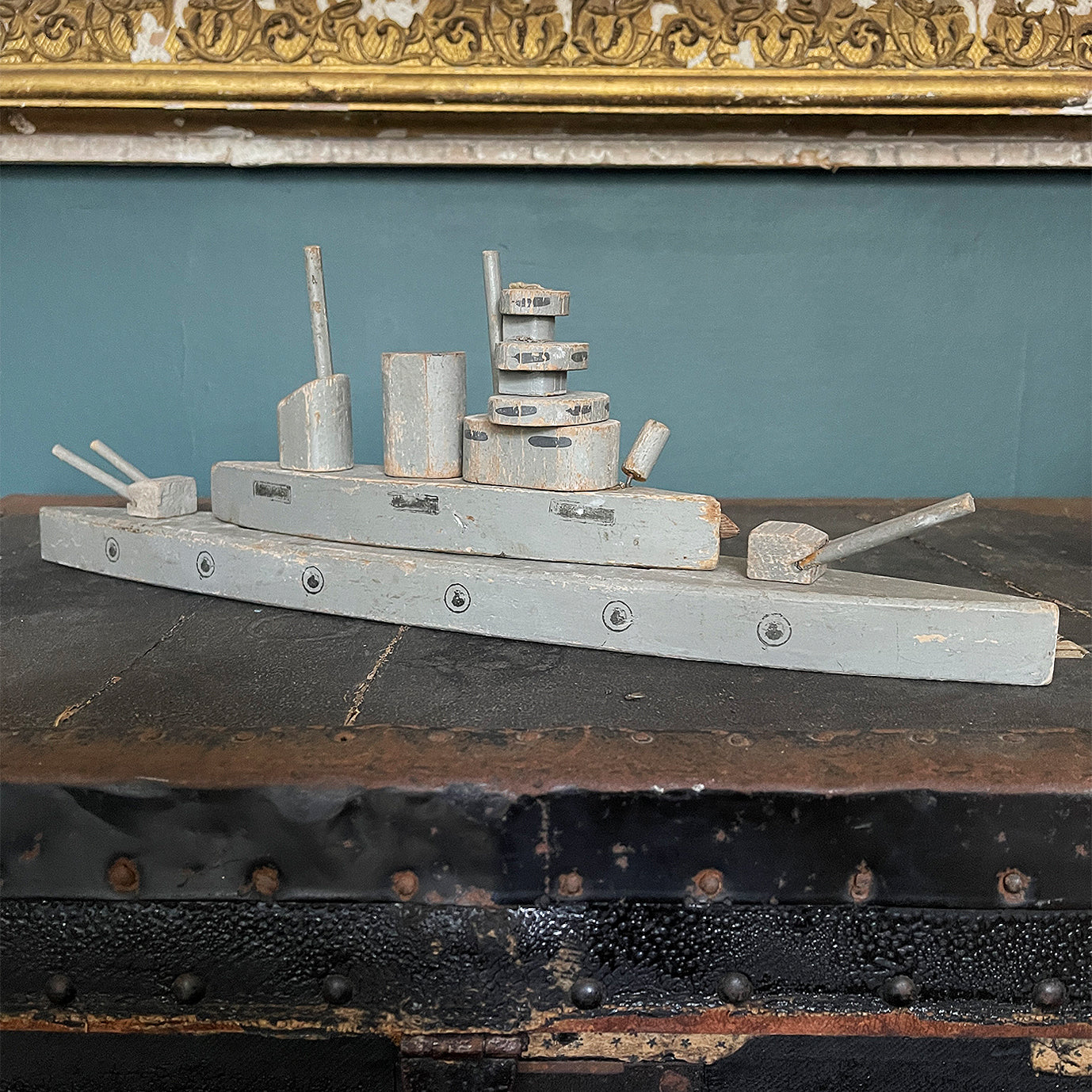 A stylish old wooden Exploding Battle Ship. Two gun turrets, two funnels, bridge and firing torpedo tube. The hull has a pressure button on the side that when struck activates an internal mechanism that explodes the top sections of the ship - SHOP NOW - www.intovintage.co.uk