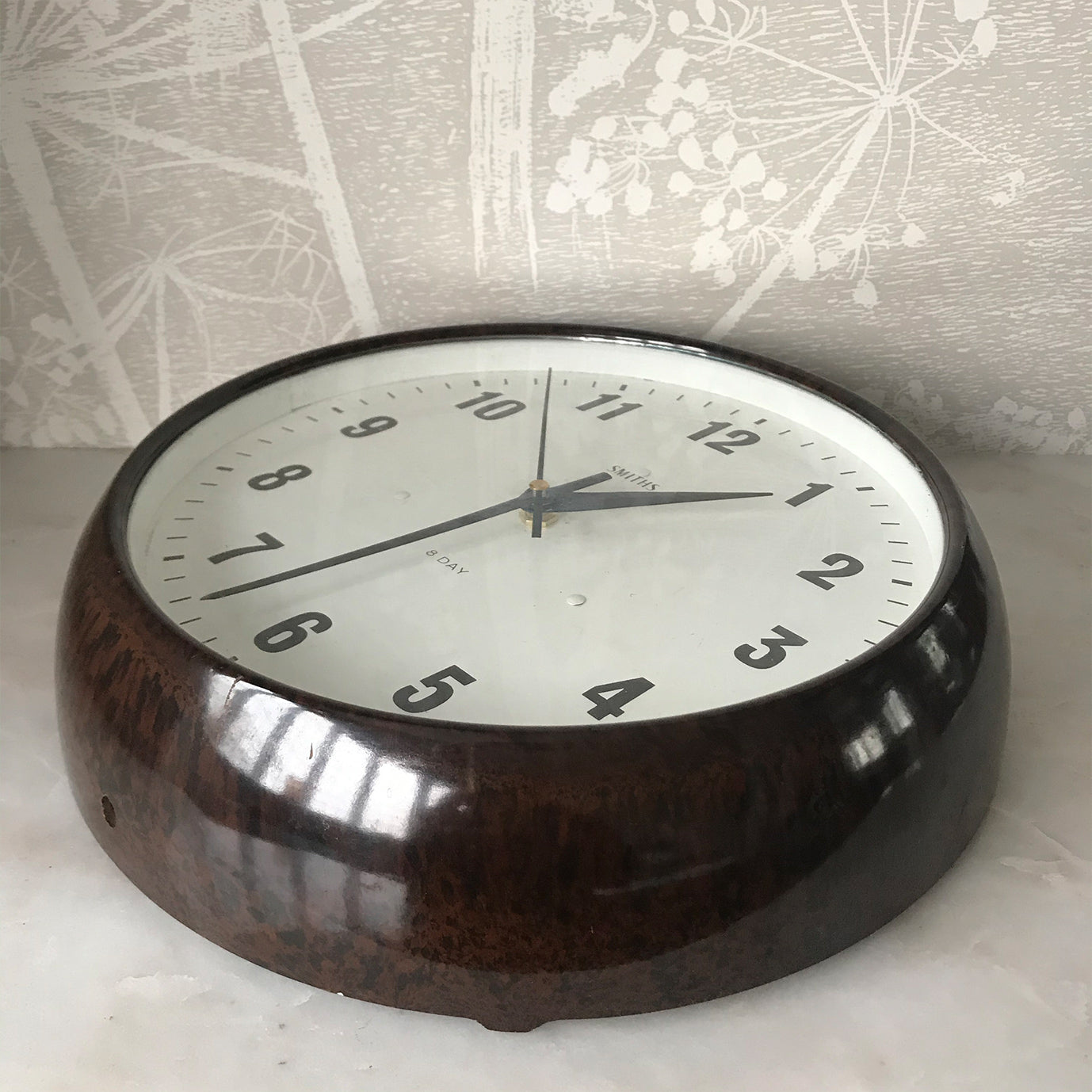 Vintage industrial/office electric Smith's wall clock from the 1940s, made by the English clock company Smiths. Made from brown/Tortoiseshell Bakelite which is in nice clean condition having been polished and waxed, with a white dial and retaining its original hands - SHOP NOW - www.intovintage.co.uk
