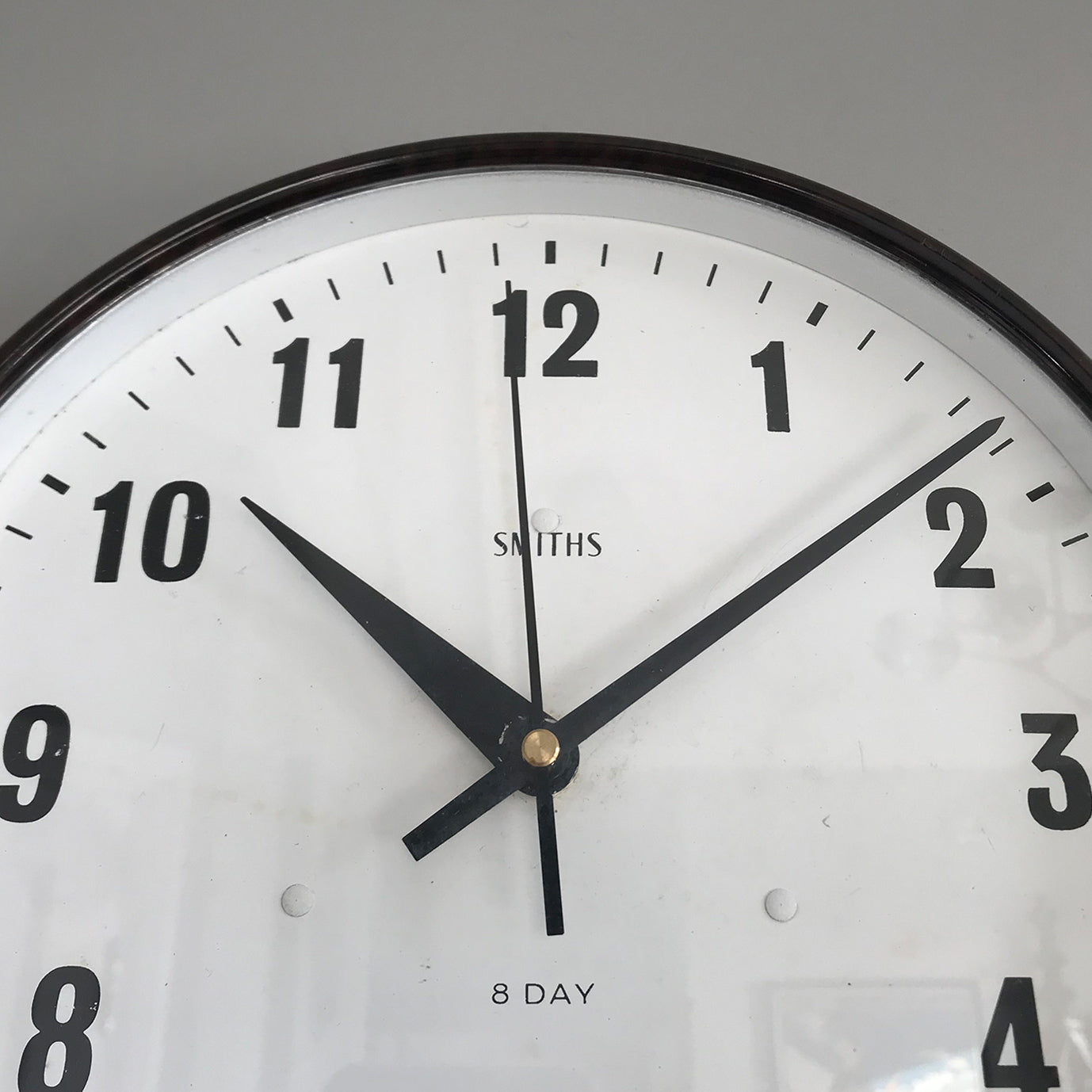 Vintage industrial/office electric Smith's wall clock from the 1940s, made by the English clock company Smiths. Made from brown/Tortoiseshell Bakelite which is in nice clean condition having been polished and waxed, with a white dial and retaining its original hands - SHOP NOW - www.intovintage.co.uk