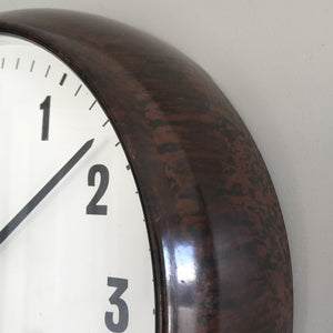 Vintage industrial/office electric Smith's wall clock from the 1940s, made by the English clock company Smiths. Made from brown/Tortoiseshell Bakelite which is in nice clean condition having been polished and waxed, with a white dial and retaining its original hands - SHOP NOW - www.intovintage.co.uk