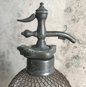 An early English soda syphon of double gourd form with a metal wire mesh net to the body, stamped 'British Syphon Company London'. Circa 1890 - SHOP NOW - www.intovintage.co.uk