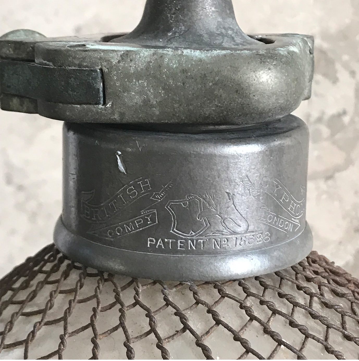 An early English soda syphon of double gourd form with a metal wire mesh net to the body, stamped 'British Syphon Company London'. Circa 1890 - SHOP NOW - www.intovintage.co.uk